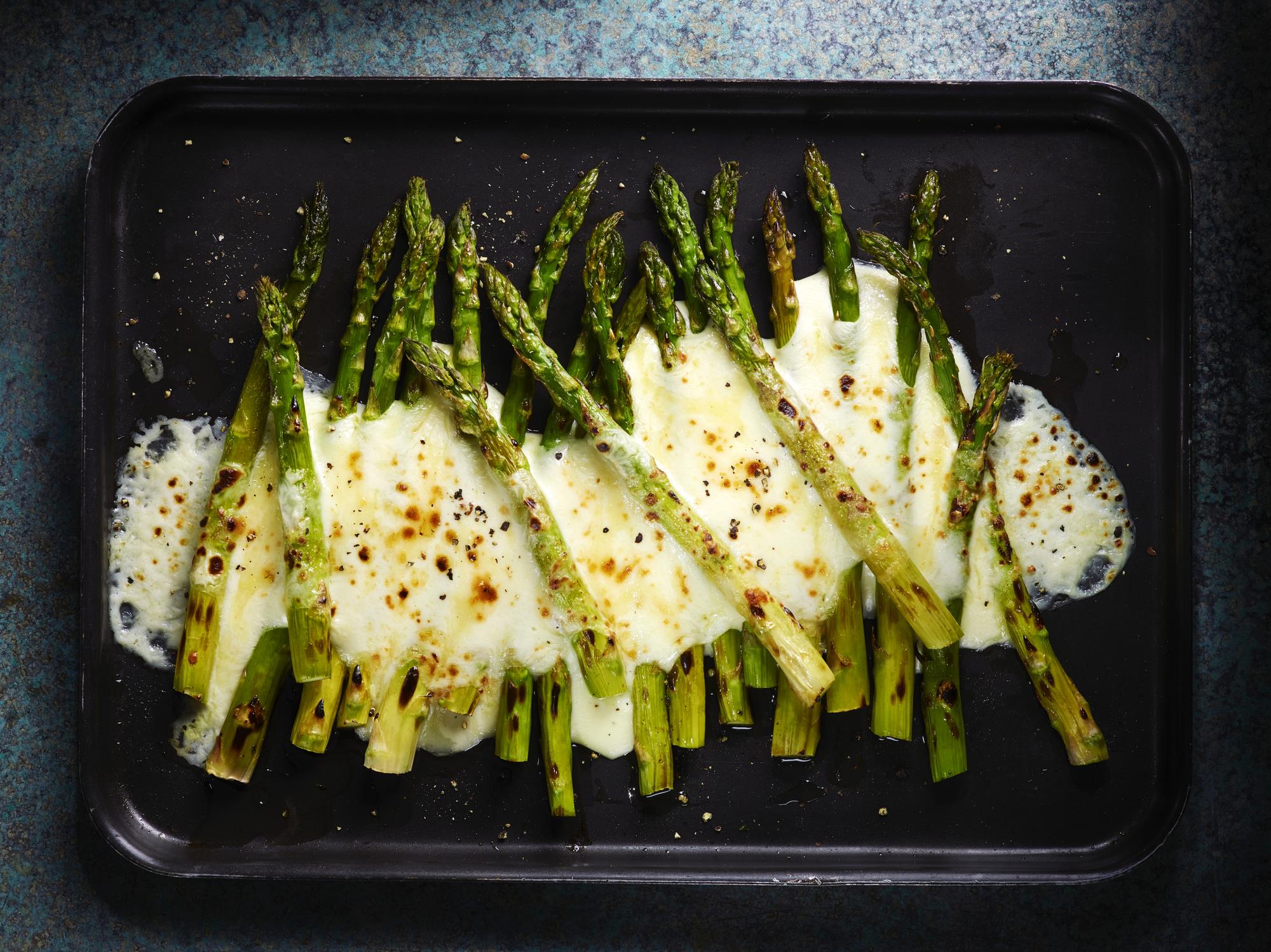 Cheesy asparagus on tray Cheesy asparagus on tray